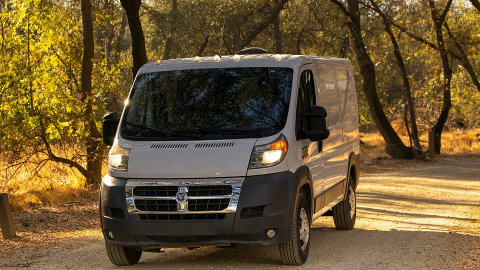 White cargo van representing regional and long-distance courier delivery
